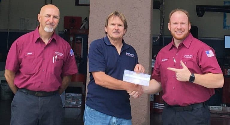 Borise Cota, National Sales Manager – Akebono Brakes Corporation (center) presents CAWA scholarship to Benjamin Hart (right), Pro-A-Line & Brakes technician, with John Dandash, Pro-A-Line owner observing.