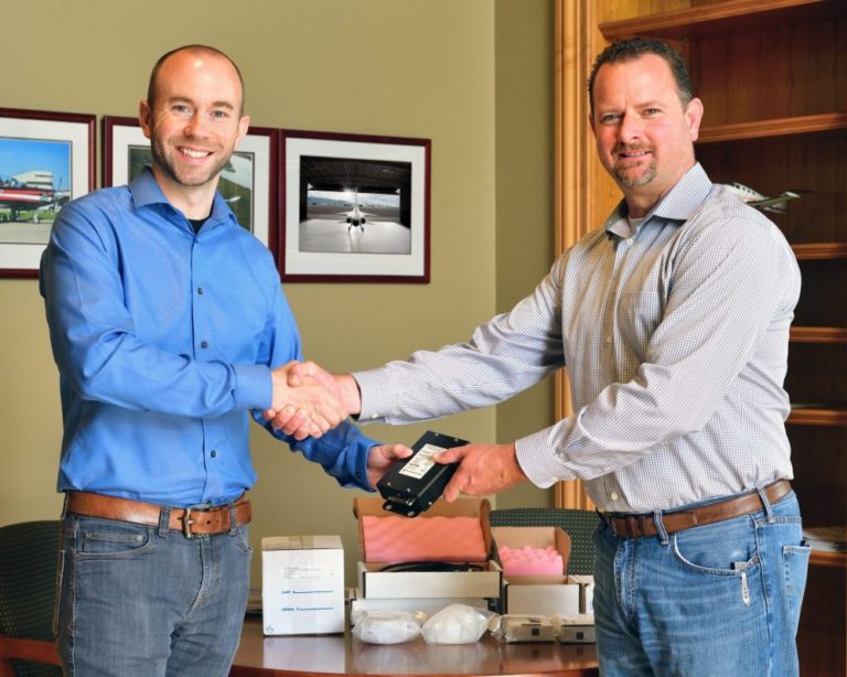 Nick Sheryka, Principal Engineer, Boom Supersonic (left) with Jeremy Kenyon, VP-Operations, Advent Aircraft Systems (right), during presentation of Advent eABS anti-skid braking system components designed for Boom’s XB-1 demonstrator aircraft
