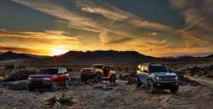 Pre-production versions of the all-new 2021 Bronco family of all-4x4 rugged SUVs, shown here, include Bronco Sport in Rapid Red Metallic Tinted Clearcoat, Bronco two-door in Cyber Orange Metallic Tri-Coat and Bronco four-door in Cactus Gray