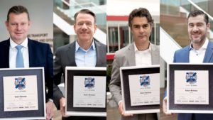 Knorr-Bremse executives display 2020 Best Brand Award from ETM publilshing house