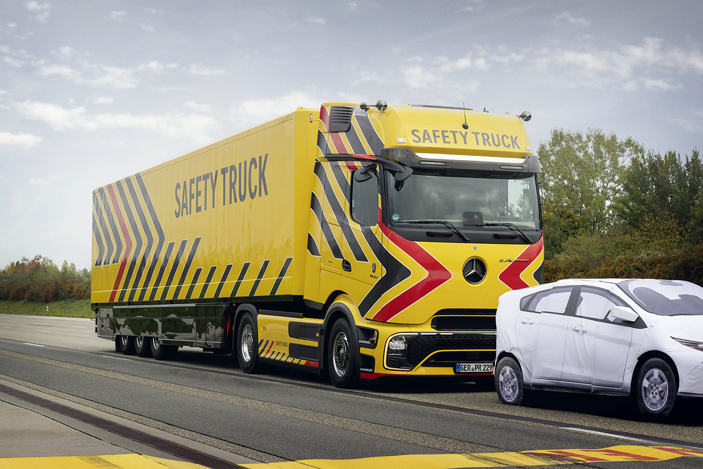 Mercedes-Benz Trucks' Safety Truck demonstrates current active and passive protection technologies on the eActros 600 platform, featuring enhanced sensor systems and automated emergency response capabilities addressing commercial vehicle accident scenarios.