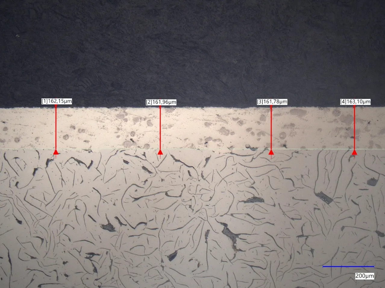 This picture shows an exemplary cross section of a single layer coating right after conducted AMS130 wear test, in this case with a layer thickness of about 160µm, containing AuerBrake®5050A in a FeCrMoNb matrix