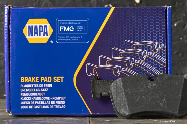 NAPA brake pad box with new FMG Eurofren Systems branding sticker showing OE+ messaging.