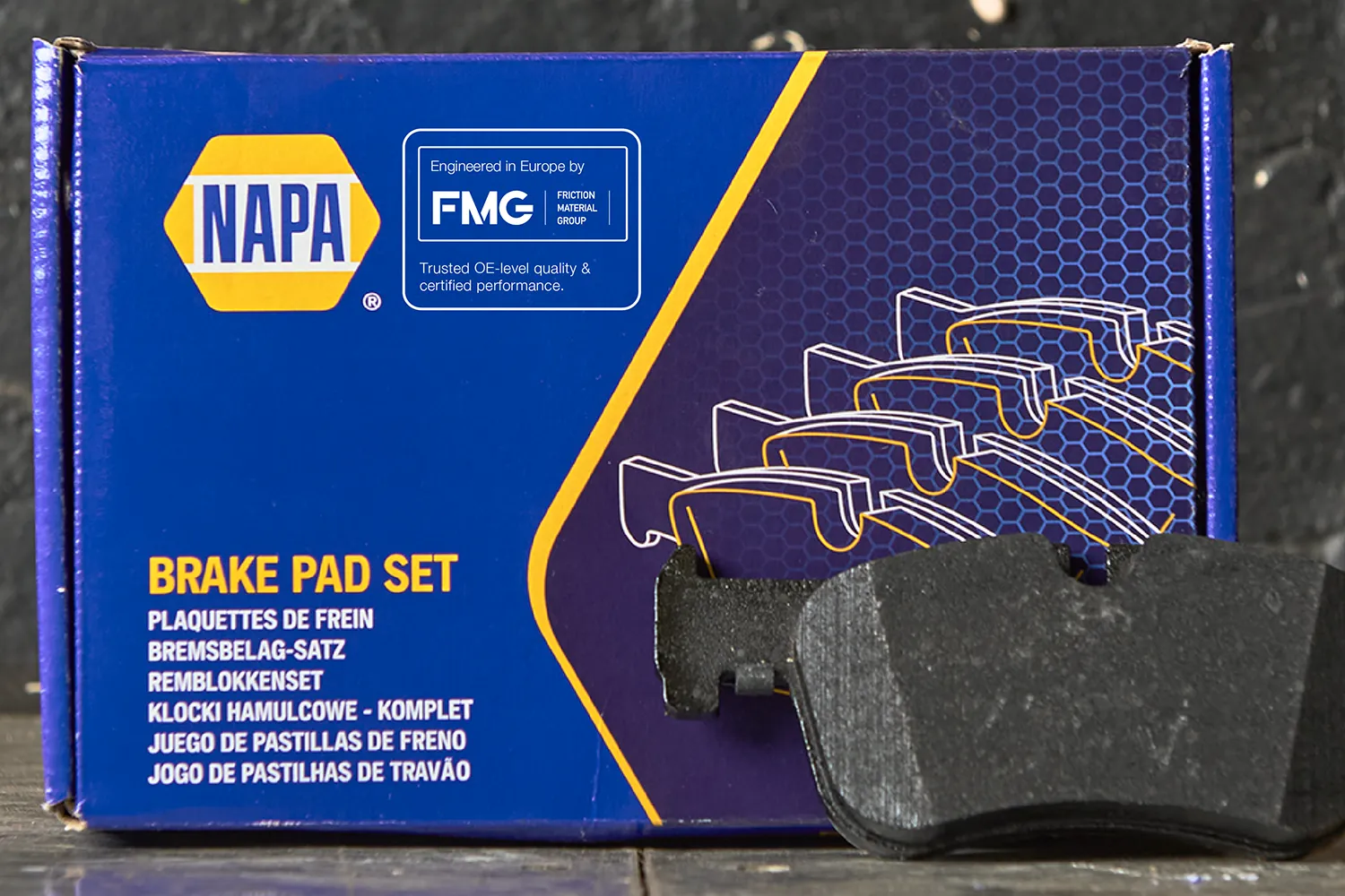 NAPA brake pad box with new FMG Eurofren Systems branding sticker showing OE+ messaging.