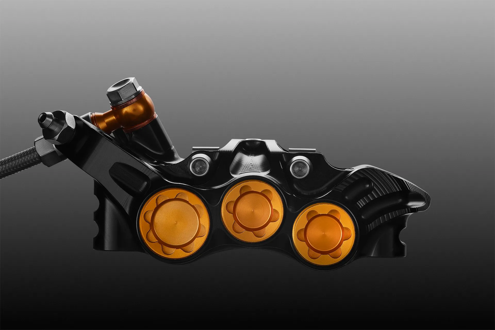 Hope EVO V6Ti six-piston brake caliper in black-and-gold Mono Edition finish