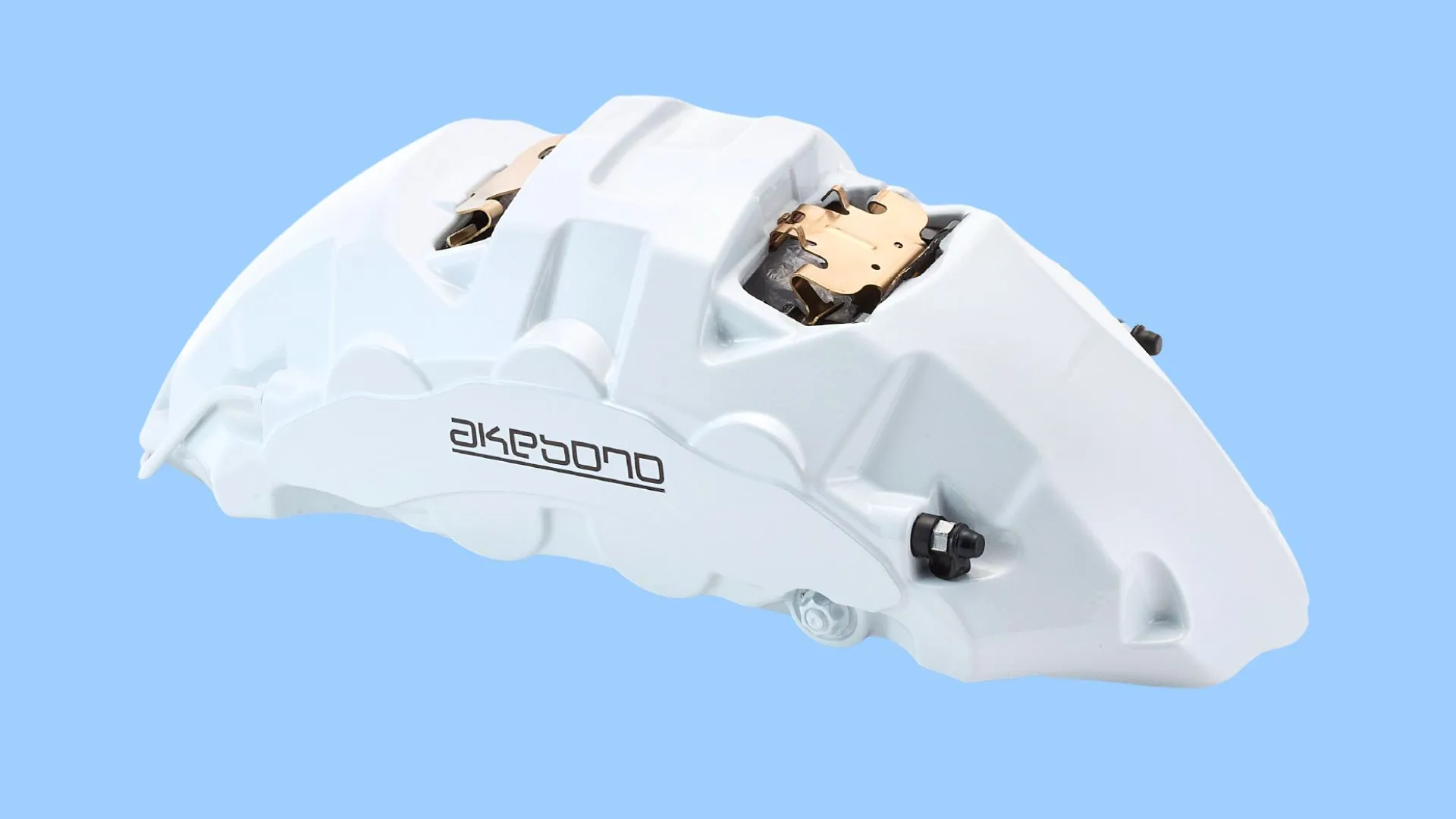 Akebono opposed-piston brake caliper on the cover of the company's Q1 results presentation for the quarter ended June 30, 2026