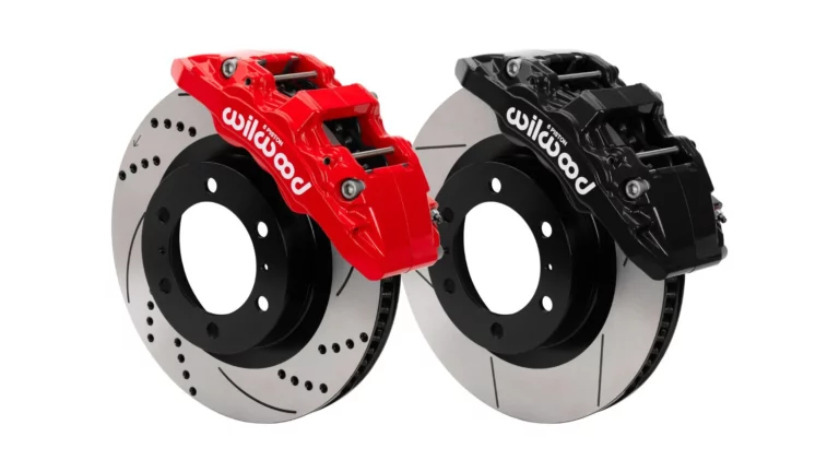 Wilwood Aero6-DM direct-mount front brake kits for the 2024-2025 Toyota Tacoma, shown with red and black six-piston Aerolite calipers on drilled and slotted rotors