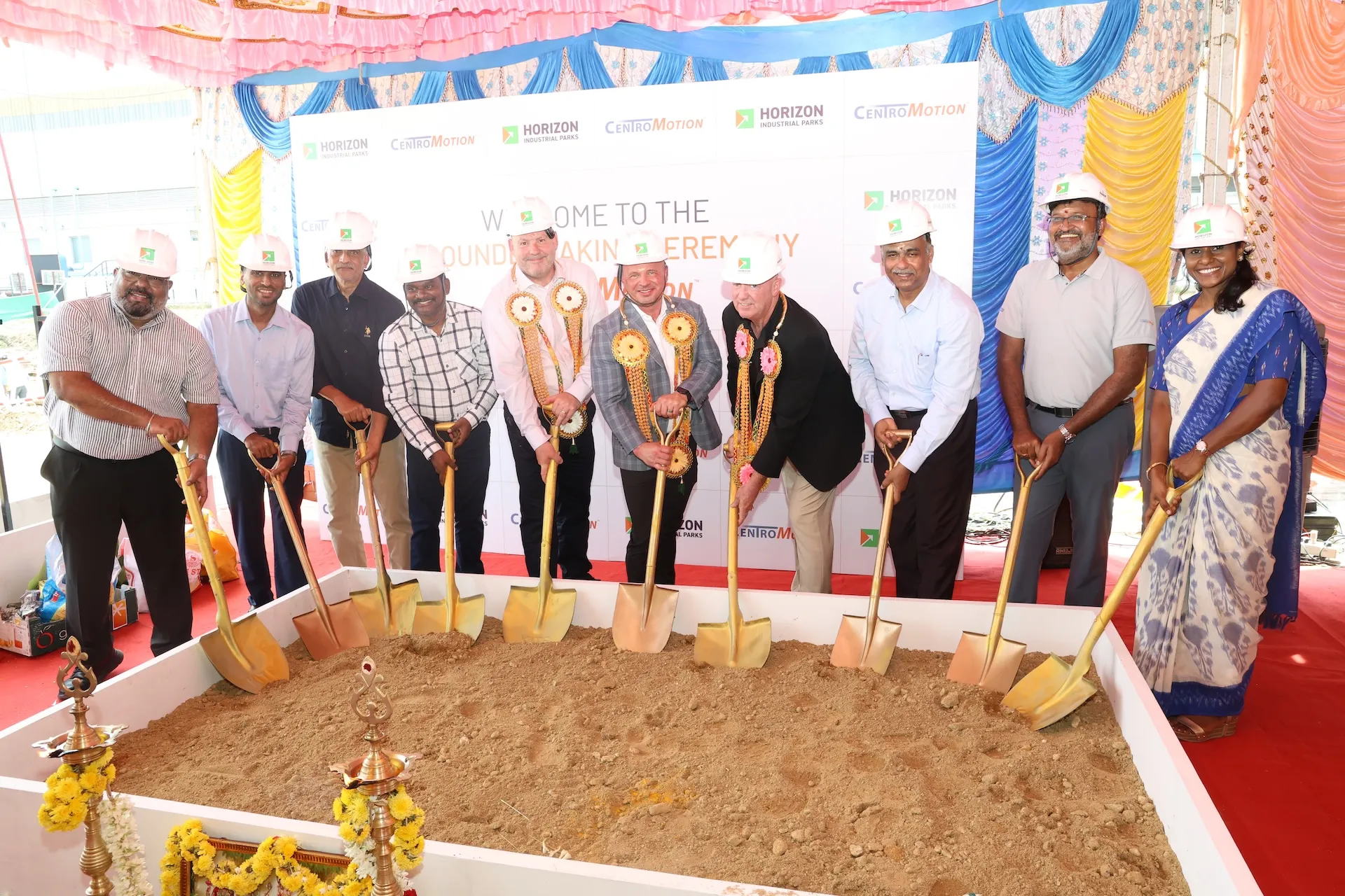 Carlisle Brake & Friction and CentroMotion executives with ceremonial shovels at the groundbreaking for the company's new Chennai wet friction plant