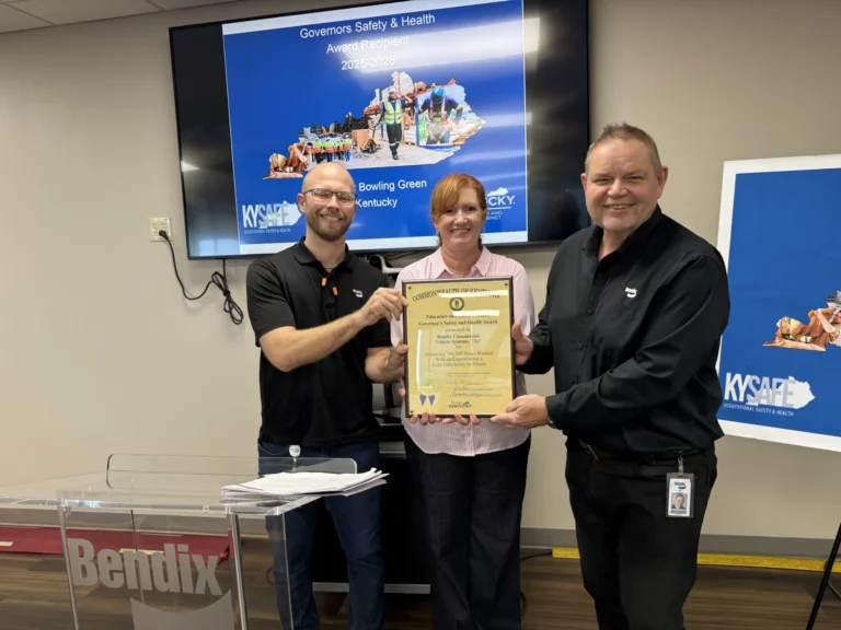 Bendix Bowling Green safety award presentation with Caleb Denman, HSE manager; Lynn Whitehouse, director of Kentucky OSH Education and Training; and Jan Jasinski, managing director of Bendix Bowling Green