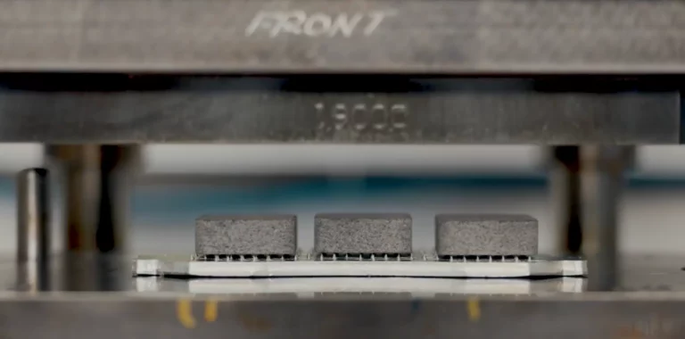 Video thumbnail of NUCAP's NRS Fusion brake pad technology, showing a friction puck pressed onto a galvanized backing plate